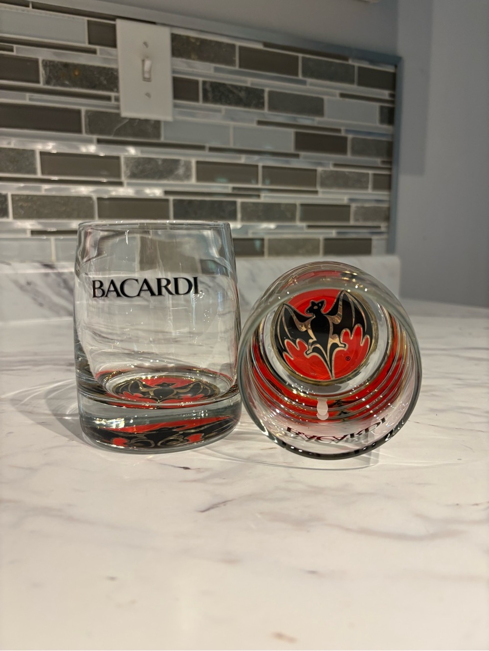 Vintage Bacardi rum lowball glasses red and black bat logo on a weighted base.